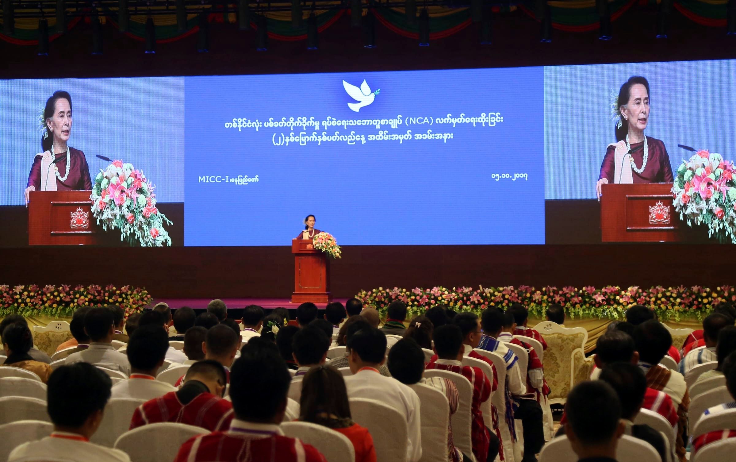 Aung San Suu Kyi speaks during the second anniversary of the signing of the NCA in Naypyidaw, Myanmar, 15 October 2017. (AP Photo/Aung Shine Oo)