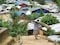 A Rohingya man carries construction material in Camp 10, 9 September 2022. (Photo: Supplied).