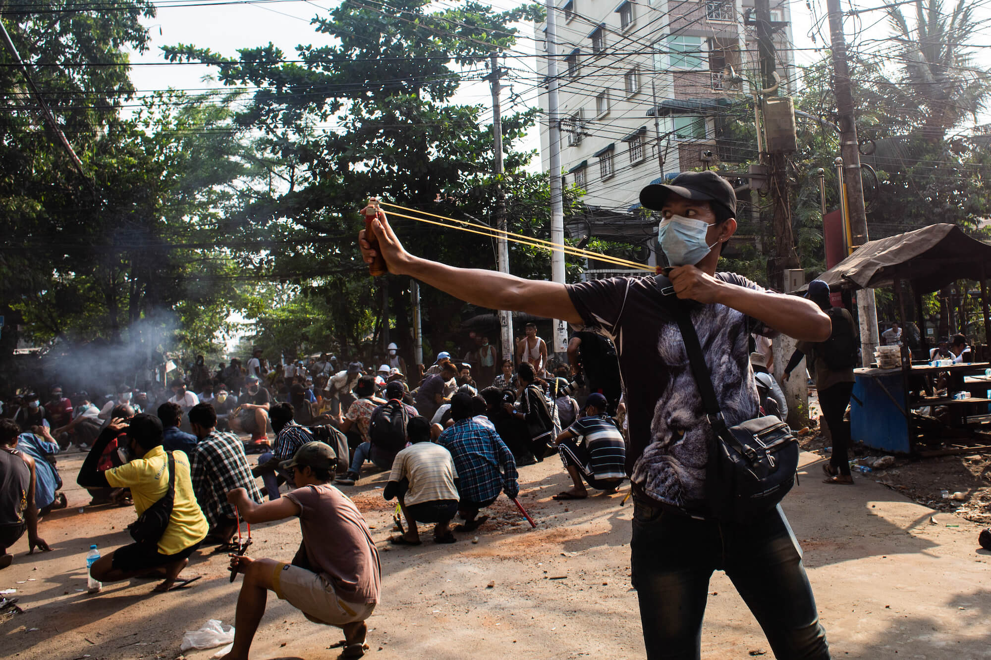Protesters attempt to resist an assault by security forces in Thaketa Township, Yangon, 28 March 2021